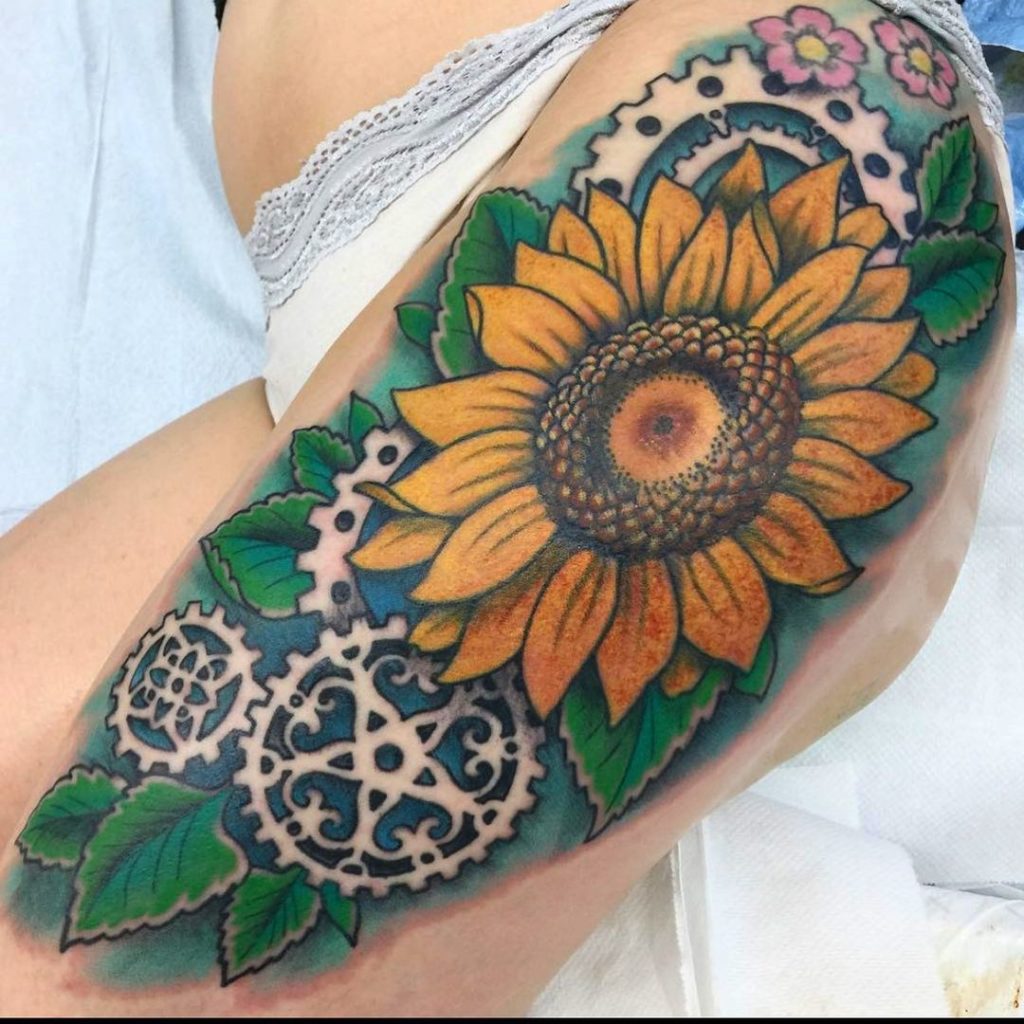 sunflower thigh tattoo