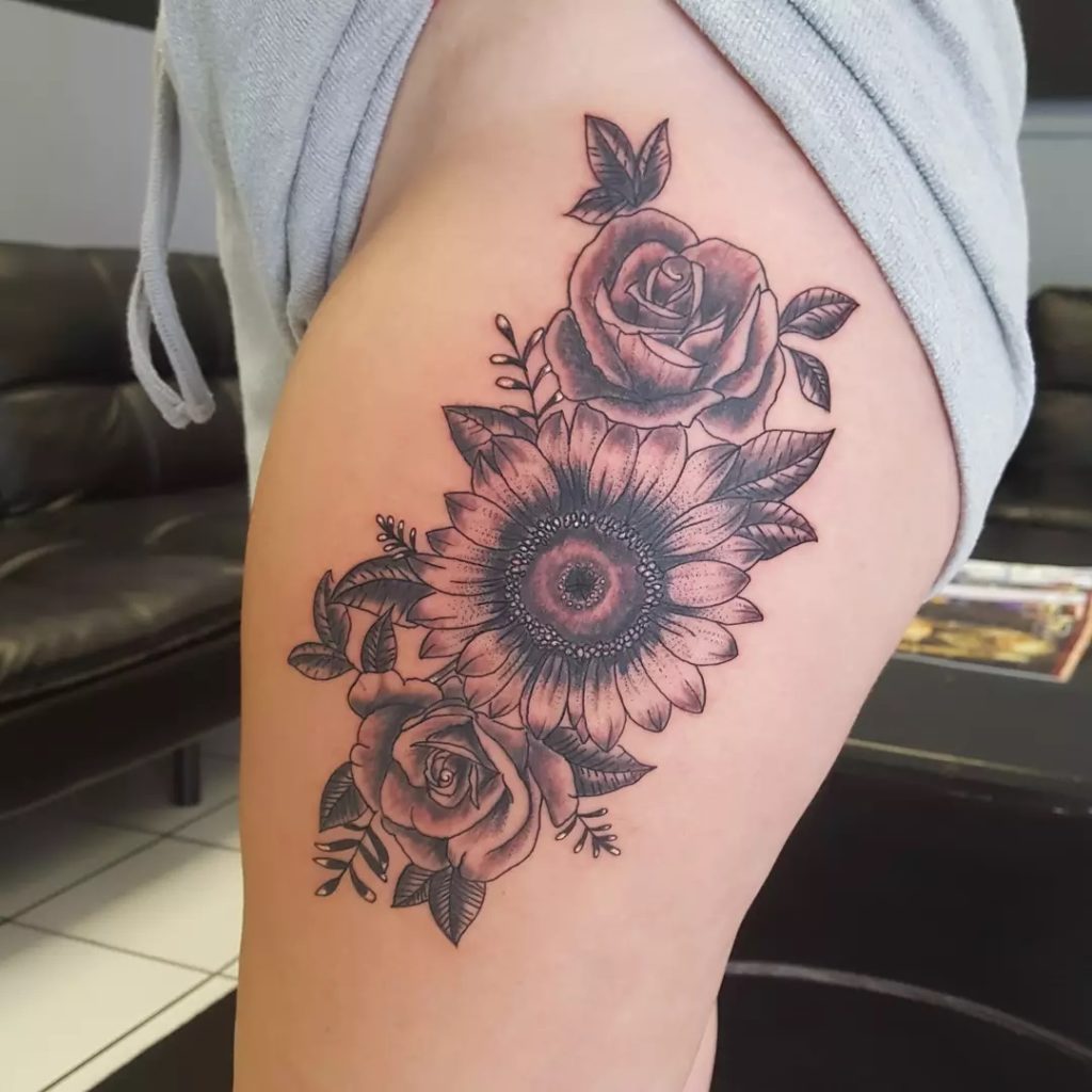 thigh sunflower tattoo